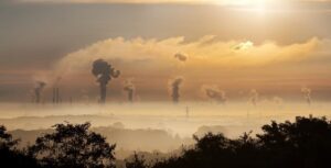 Image of emissions for an industrial area set in the distance