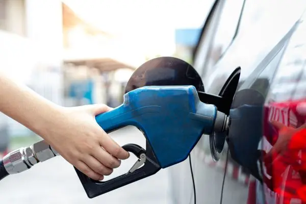 Image of car being fuelled with petrol, a Scope 1 emission source.