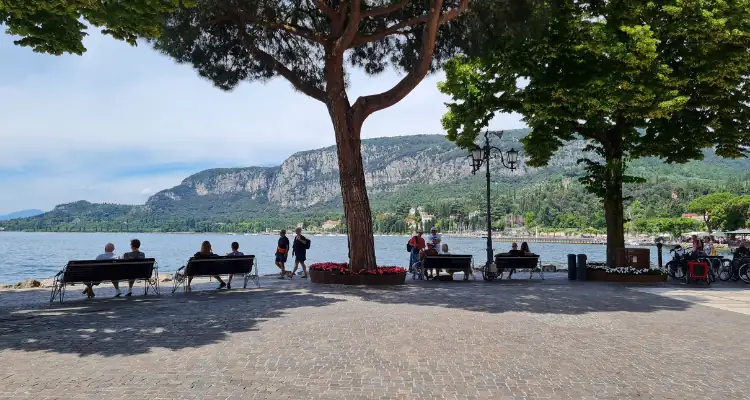 Image of a sustainable travel destination, showing a seating area overlooking a coastal bay. 